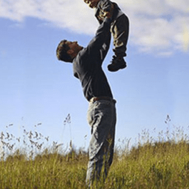 A Father Lifting a Child